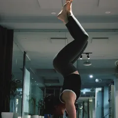 Finding stillness in a forearm stand, or Pincha Mayurasana. This inversion requires a lot of practice to find the right balance point, engaging the entire body from the forearms to the core and toes.