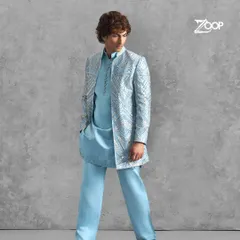 Celebrate in a style that is both sophisticated and timeless. This light blue kurta set with a shimmering, patterned jacket is meticulously crafted for the modern groom or wedding guest.