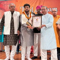 Posing with the award and certificate. A moment of immense gratitude.