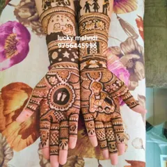 Baby shower mehndi is very special. This design tells the story of a growing family, with motifs like baby footprints, a cradle, and family figures, all woven into a beautiful full-hand design.