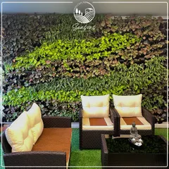 A close-up of a thriving vertical garden, showcasing the rich tapestry of colors and textures we create. The combination of bright greens, deep purples, and variegated leaves turns this wall into a living masterpiece.