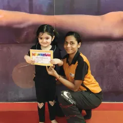 A happy smile and a new certificate! We celebrate every milestone, big or small.