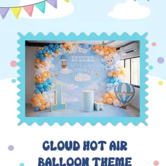 For Kavir's first birthday, we designed this adorable cloud and hot air balloon theme. The setup features a sky-blue backdrop with fluffy clouds, balloon garlands in orange and blue, and a custom "1" marquee number.