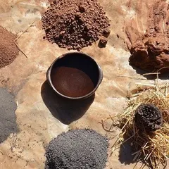 These are natural materials extracted directly from a project site. I often experiment with local soil, lime, and other earthy elements for use in sustainable techniques like cob construction, connecting the building to its environment.