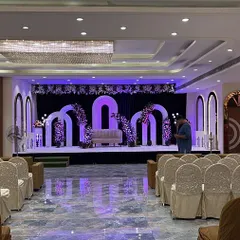 This is the Sky Banquet hall in Kharghar, set up and ready for a wedding. The stage is decorated with beautiful arches and lighting, and the hall has a seating capacity of up to 700 guests.