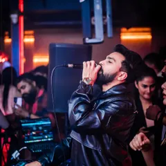 It's more than just playing tracks; it's about feeling the music and sharing that passion with everyone on the dance floor. This is me in my element, connecting with the crowd at The Fixx Bar during a high-energy Bollywood set.