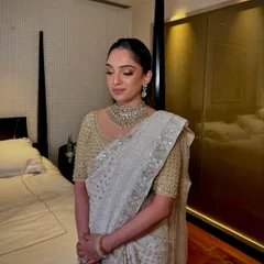 A full view of the elegant look for the Ambani wedding. The makeup is soft, glowing, and sophisticated, designed to be perfect for such a grand and memorable occasion.