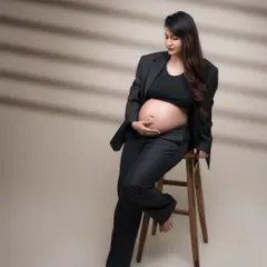 Empowered, elegant, enduring. This portrait is a story of a boss lady, embracing the miracle of life while owning her power in a stylish suit.