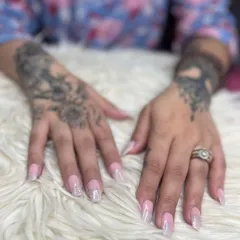 A soft and feminine look with a pink-to-white ombre base and a sparkling silver glitter fade on square-shaped extensions.