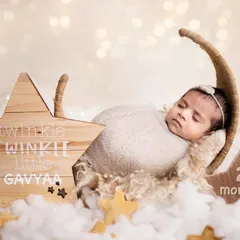 This little one, Gavyaa, is two months old here, swaddled snugly for her portrait. While classic newborn poses are best for younger babies, we can still create beautiful, dreamy photos for slightly older infants.