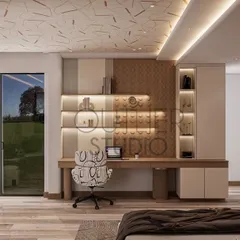 A view of the functional and stylish study area in the teenage girl's bedroom. The space includes a built-in desk with ample shelving and a unique patterned ceiling that adds a touch of creativity.