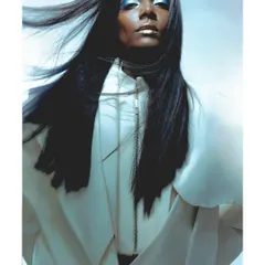 A futuristic beauty look for model Carlx Martin. The metallic makeup, sleek hair, and cool blue lighting combine to create a powerful, otherworldly portrait.