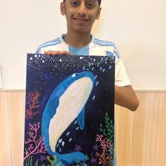 Look at the incredible detail and pride on this young artist's face. This stunning whale canvas is a perfect example of how I guide students to create artwork they can be truly proud of.
