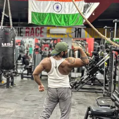 Showing off a 16-inch bicep. This back shot highlights the size and definition of my arms and lats.