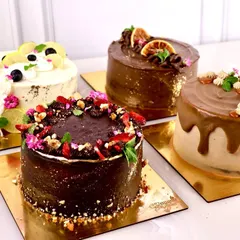 A collection of our healthy cakes. These are all gluten free, dairy free, and refined sugar free, but they don't compromise on flavor or texture. From a rich chocolate cake to a zesty lemon blueberry, there's a clean treat for everyone.