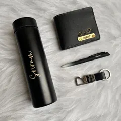 This sleek, all-black gift set is a popular choice for men. It includes a personalized turbo bottle, a vegan leather wallet, a pen, and a hook keychain, all customized with a name.