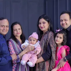 Grandparents, parents, and children all together. I love the mix of generations and the proud smiles on everyone's faces as they hold the youngest members of the family.