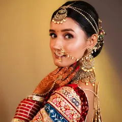 Another beautiful shot of a model from our student examination, showcasing a classic bridal pose and flawless makeup.