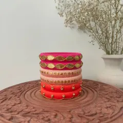 A beautiful set of bangles in shades of pink and orange. I've used gota patti work and golden beads to create an elegant design that's perfect for festive wear.
