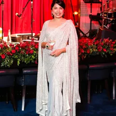Blending modern style with timeless grace. I designed this custom silver drape saree with dramatic accentuated sleeves for a client who wanted to shine at her cocktail event.