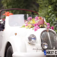 The perfect getaway car. A beautifully decorated vintage car adds a touch of classic romance and makes for a fantastic photo opportunity.