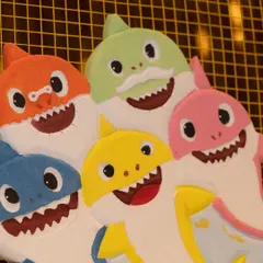 A close-up of the custom-made Baby Shark family prop. Getting the characters just right is so important for a themed party, and these happy faces brought so much joy to the kids.