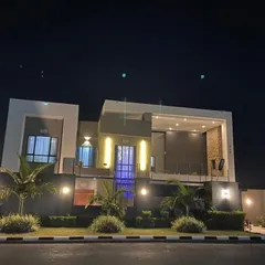 A home's personality shines brightest at night. We use strategic, multi-layered lighting to accentuate the architectural lines, create dramatic shadows, and give the residence a warm, inviting glow that stands out after dark.