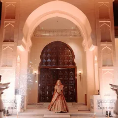 A bride's entry should be nothing short of majestic. We conceptualized this royal procession with a stunning architectural backdrop and perfectly timed cold pyros to create a truly regal and unforgettable varmala moment.