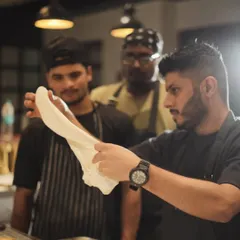 The art of teaching and learning. Here I am with my team, sharing the techniques and passion that go into our food. A great kitchen is built on teamwork and a shared love for cooking.