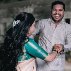 A playful moment captured during their pre-wedding session. The groom's hearty laugh shows the fun and relaxed atmosphere we create during our shoots.