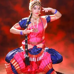 A powerful and grounded pose from the classical dance series. The lighting is carefully placed to sculpt the dancer's features and the folds of her costume.