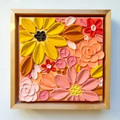 A finished and framed floral texture painting. The warm color palette and variety of flower shapes create a cheerful and vibrant piece of art.