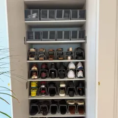 For everyday footwear, function is key. We use shoe stackers and shelf organizers to maximize space and keep every pair visible and tidy. Labeled boxes on top store seasonal or less-used pairs.