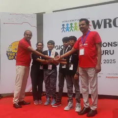 Celebrating a double victory. Here, one of our elementary teams accepts their silver medal at the WRO 2025 regional round, securing their spot at the nationals after competing against more than 100 other teams.