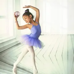 A graceful and elegant portrait of a young ballerina. The projected background of a bright, airy dance studio provides the perfect clean and minimalist setting for this beautiful pose.