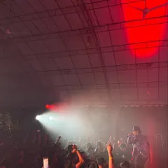 A powerful shot from my first show in Singapore. The red lights, the smoke, and the hands in the air capture the intense, electrifying atmosphere of my live performances.
