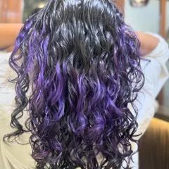 Just a pop of purple to brighten up your hair. This is a fantastic way to add a creative touch with peekaboo highlights that look stunning on dark hair.