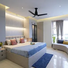 This master bedroom is a sanctuary of comfort and style. I designed it with custom wardrobes, a serene color palette, and a cozy curved window seat, creating a perfect retreat for rest and relaxation.