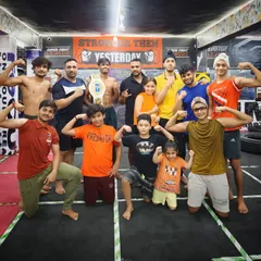 Flexing our strength as a team. This is the family we have built, from the youngest kids to the professional fighters.