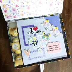 I love a creative challenge. This scrapbook was designed for a retiring chemistry professor, complete with "I Love Chemistry" details and even some Ferrero Rocher chocolates tucked inside the gift box for an extra sweet surprise.