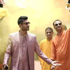 Making a grand entrance is key to setting the tone for the celebration. Here, I'm leading the charge at a Haldi ceremony, making sure the energy is high right from the start with color, music, and a whole lot of style.