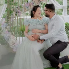 This is for all my mommies-to-be. This beautiful image captures such a tender moment, and our light blue gown is designed to be both comfortable and elegant, perfectly draping over your baby bump. The front slit is a thoughtful detail to beautifully highlight your belly.