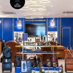 The Brune & Bareskin flagship store is an immersion in luxury. We used a palette of royal blue and polished brass, with bespoke lighting and display units, to create a retail experience that is both grand and intimate.