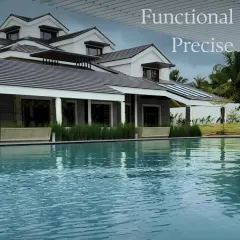 A quiet conversation between structure and water. The clean, functional lines of this poolside building are softened by the gentle ripples of the water and the row of ornamental grasses.