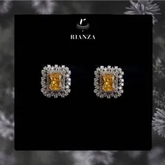 These are our popular changeable color stone earrings, shown here with a vibrant yellow sapphire. The central stone can be swapped to match different outfits, making them a valuable trousseau piece.