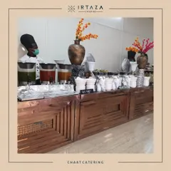 A classic chaat catering station. My chef is ready to serve up a variety of popular Indian street food snacks, complete with all the chutneys and toppings for a customized treat.