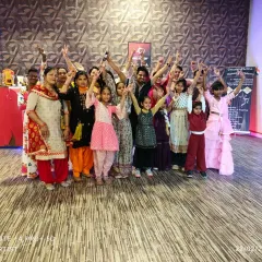 A happy group photo after a successful and energetic dance workshop. Everyone learned something new and had a great time.