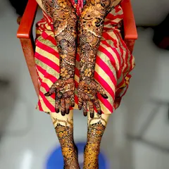 A complete bridal mehndi package. I create stunning, coordinated designs for both hands and feet, ensuring a breathtaking look for your wedding day. This design features intricate floral and paisley patterns from fingertips to elbows and across the feet.