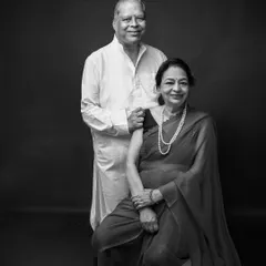 The same portrait in black and white, which adds a different layer of emotion and timelessness. It focuses purely on their expressions and the gentle way they hold each other.
