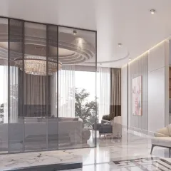 A glass partition provides a subtle separation between living zones while maintaining an open feel. The reflection of the chandelier adds another layer of visual interest.